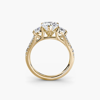 Three stone split shank pavé engagement ring setting with yellow gold finish, showcasing detailed craftsmanship and sparkling pavé accents.