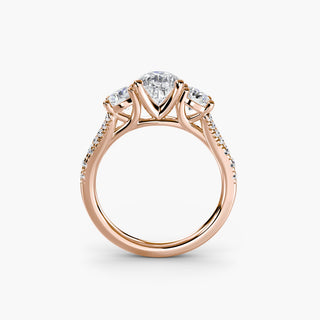 Three stone split shank pavé engagement ring setting with pear-shaped center stone from LabGrownDiamonds.com, front view.