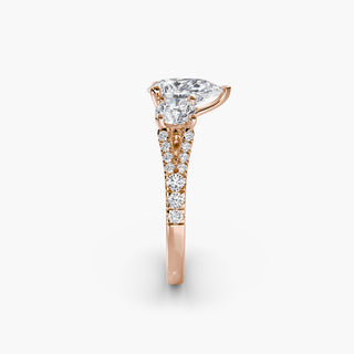 Three stone split shank pavé engagement ring setting with pear-shaped center stone and side accents, crafted by LabGrownDiamonds.com