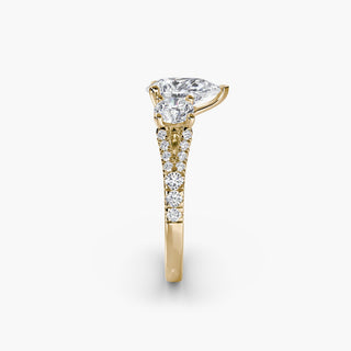Three stone split shank pavé engagement ring setting with pear-shaped center, crafted by LabGrownDiamonds.com, featuring detailed metalwork.