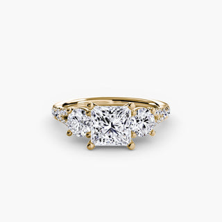 Three stone split shank pavé engagement ring setting with yellow gold finish, featuring intricate detailing and sparkling diamond accents.