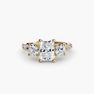 Three stone split shank pavé engagement ring setting with yellow gold finish, featuring sparkling pavé accents and a modern design.