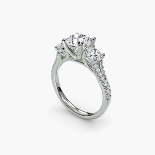 Three stone split shank pavé engagement ring setting in white gold with round diamonds, showcasing detailed craftsmanship from multiple angles.