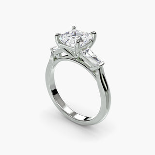 Three stone engagement ring setting in white gold with an asscher-cut lab grown center diamond and tapered baguette side stones, three-quarter view. || #metal_white gold|platinum #diamond shape_asscher