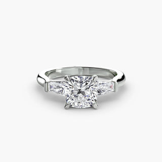 Three stone engagement ring setting in white gold, featuring a cushion-cut lab grown center diamond with tapered baguette side stones. || #metal_white gold|platinum #diamond shape_cushion