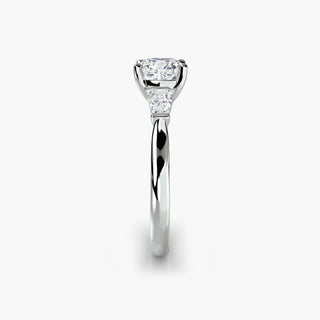 Three stone engagement ring setting in white gold showing the band profile, with a cushion-cut lab grown center diamond and tapered baguette side stones. || #metal_white gold|platinum #diamond shape_cushion