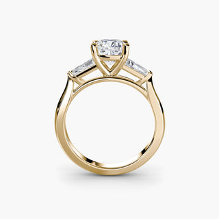 Three stone engagement ring setting in yellow gold, side profile view with a cushion-cut lab grown center diamond and tapered baguette side stones. || #metal_yellow gold #diamond shape_cushion