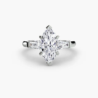 Three stone engagement ring setting in white gold, featuring a marquise-cut lab grown center diamond with tapered baguette side stones. || #metal_white gold|platinum #diamond shape_marquise