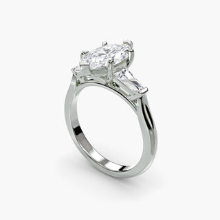 Three stone engagement ring setting in white gold with a marquise-cut lab grown center diamond and tapered baguette side stones, three-quarter view. || #metal_white gold|platinum #diamond shape_marquise