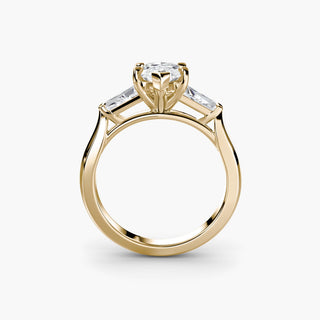 Three stone engagement ring setting in yellow gold, side profile view with a marquise-cut lab grown center diamond and tapered baguette side stones. || #metal_yellow gold #diamond shape_marquise