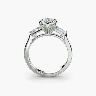 Three stone engagement ring setting in white gold, side profile view with a pear-shaped lab grown center diamond and tapered baguette side stones. || #metal_white gold|platinum #diamond shape_pear