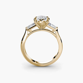 Three stone engagement ring setting in yellow gold, side profile view with a pear-shaped lab grown center diamond and tapered baguette side stones. || #metal_yellow gold #diamond shape_pear