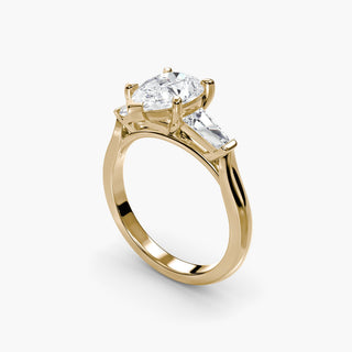 Three stone engagement ring setting in yellow gold with a pear-shaped lab grown center diamond and tapered baguette side stones, three-quarter view. || #metal_yellow gold #diamond shape_pear