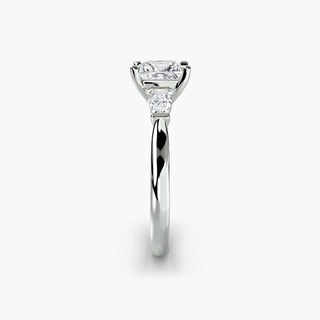 Three stone engagement ring setting in white gold showing the band profile, with a princess-cut lab grown center diamond and tapered baguette side stones. || #metal_white gold|platinum #diamond shape_princess