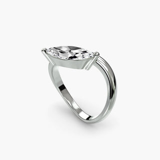 Curved lab grown diamond ring in white gold with a horizontally set marquise lab grown diamond on a sculptural wave band, three-quarter view. || #metal_white gold|platinum