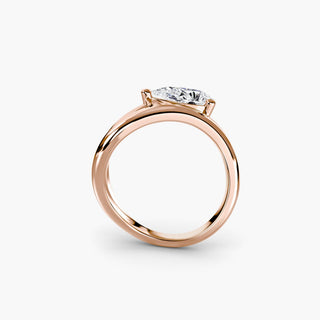 Wave lab grown diamond ring in rose gold, side profile view showing the flowing wave band with a pear-shaped lab grown diamond. || #metal_rose gold