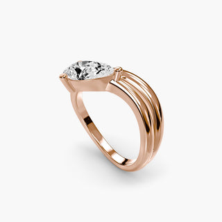 Wave lab grown diamond ring in rose gold with a pear-shaped lab grown diamond on a sculptural wave band, three-quarter view. || #metal_rose gold