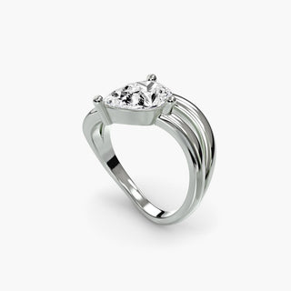 Double wave lab grown diamond ring in white gold with a pear-shaped lab grown diamond between two flowing wave bands, three-quarter view. || #metal_white gold|platinum