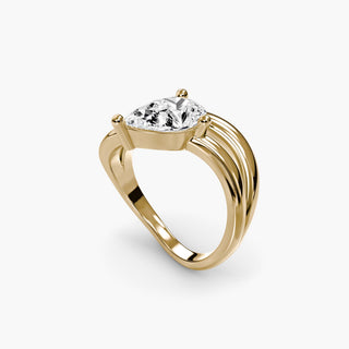 Double wave lab grown diamond ring in yellow gold with a pear-shaped lab grown diamond between two flowing wave bands, three-quarter view. || #metal_yellow gold