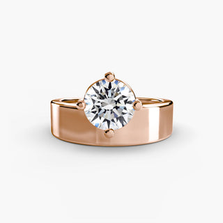 Solitaire engagement ring setting in rose gold, featuring a round lab grown diamond on a bold wide band with compass prongs. || #metal_rose gold #diamond shape_round