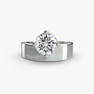 Solitaire engagement ring setting in white gold, featuring a round lab grown diamond on a bold wide band with compass prongs. || #metal_white gold|platinum #diamond shape_round