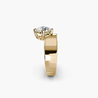 Solitaire engagement ring setting in yellow gold showing the wide band profile with a round lab grown diamond. || #metal_yellow gold #diamond shape_round