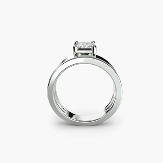 Solitaire engagement ring setting in white gold, side profile view showing the wide band with an emerald-cut lab grown diamond. || #metal_white gold|platinum