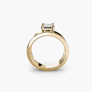 Solitaire engagement ring setting in yellow gold, side profile view showing the wide band with an emerald-cut lab grown diamond. || #metal_yellow gold