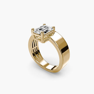 Solitaire engagement ring setting in yellow gold with an emerald-cut lab grown diamond on a sculptural wide band, three-quarter view. || #metal_yellow gold