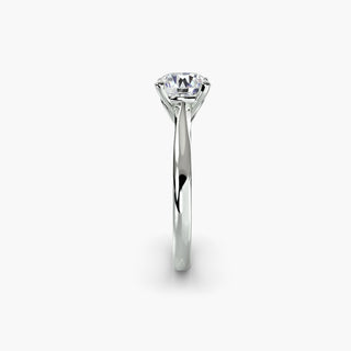 Solitaire engagement ring setting in white gold showing the profile of the tapered band and cathedral setting. || #metal_white gold|platinum #diamond shape_round