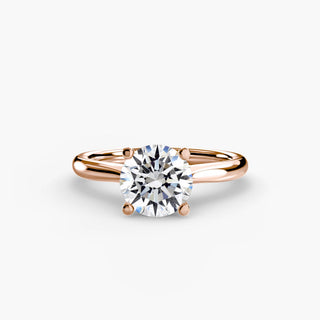 Solitaire engagement ring setting with a round lab grown diamond and a tapered rose gold band. || #metal_rose gold #diamond shape_round