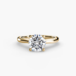 Solitaire engagement ring setting with a round lab grown diamond and a tapered yellow gold band. || #metal_yellow gold #diamond shape_round