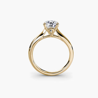 Solitaire engagement ring setting in yellow gold, side profile view showing the cathedral shoulders and loop-style basket. || #metal_yellow gold #diamond shape_round
