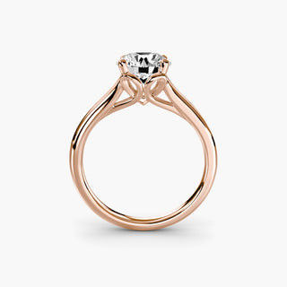 Split shank engagement ring setting in rose gold, side profile view showing the heart-shaped basket and cathedral shoulders. || #metal_rose gold #diamond shape_round