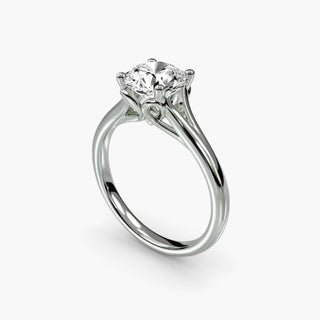Split shank engagement ring setting with a solitaire round lab grown diamond in white gold, three-quarter view. || #metal_white gold|platinum #diamond shape_round