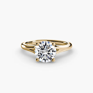 Split shank engagement ring setting with a solitaire round lab grown diamond on a yellow gold band. || #metal_yellow gold #diamond shape_round