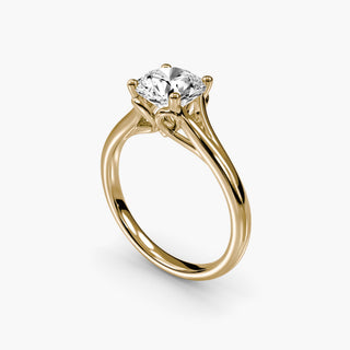 Split shank engagement ring setting with a solitaire round lab grown diamond in yellow gold, three-quarter view. || #metal_yellow gold #diamond shape_round