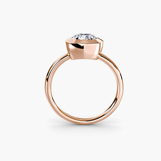 Bezel solitaire engagement ring setting in rose gold, side profile view with a cushion-cut lab grown diamond. || #metal_rose gold #diamond shape_cushion