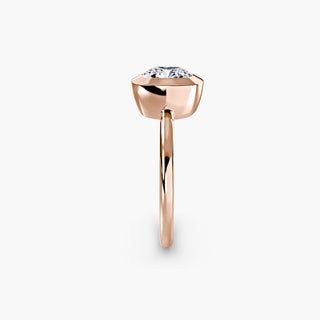 Bezel solitaire engagement ring setting in rose gold showing the band profile, with a cushion-cut lab grown diamond. || #metal_rose gold #diamond shape_cushion