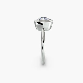 Bezel solitaire engagement ring setting in white gold showing the band profile, with a cushion-cut lab grown diamond. || #metal_white gold|platinum #diamond shape_cushion