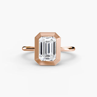 Bezel solitaire engagement ring setting in rose gold, featuring an emerald-cut lab grown diamond in a smooth sculpted bezel. || #metal_rose gold #diamond shape_emerald