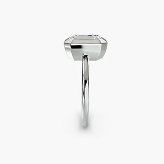 Bezel solitaire engagement ring setting in white gold showing the band profile, with an emerald-cut lab grown diamond. || #metal_white gold|platinum #diamond shape_emerald
