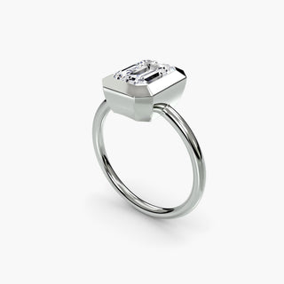 Bezel solitaire engagement ring setting in white gold with an emerald-cut lab grown diamond, three-quarter view. || #metal_white gold|platinum #diamond shape_emerald