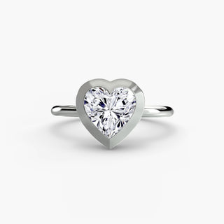 Bezel solitaire engagement ring setting in white gold, featuring a heart-shaped lab grown diamond in a smooth sculpted bezel. || #metal_white gold|platinum #diamond shape_heart
