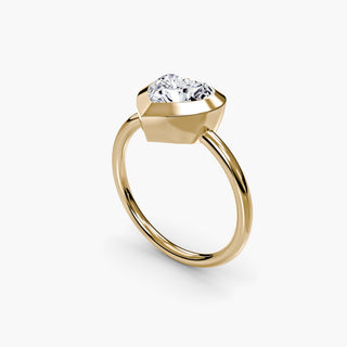 Bezel solitaire engagement ring setting in yellow gold with a heart-shaped lab grown diamond, three-quarter view. || #metal_yellow gold #diamond shape_heart
