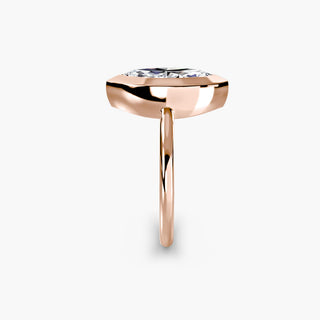 Bezel solitaire engagement ring setting in rose gold showing the band profile, with a marquise-cut lab grown diamond. || #metal_rose gold #diamond shape_marquise