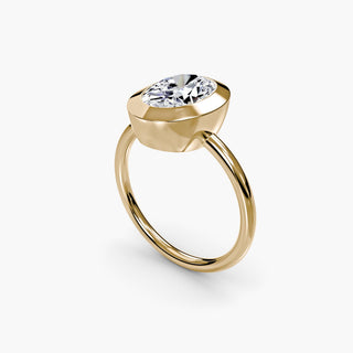 Bezel solitaire engagement ring setting in yellow gold with an oval-cut lab grown diamond, three-quarter view. || #metal_yellow gold #diamond shape_oval