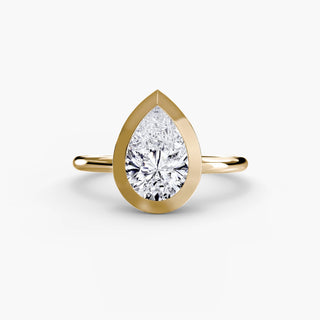 Bezel solitaire engagement ring setting in yellow gold, featuring a pear-shaped lab grown diamond in a smooth sculpted bezel. || #metal_yellow gold #diamond shape_pear