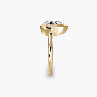 Bezel solitaire engagement ring setting in yellow gold showing the band profile, with a pear-shaped lab grown diamond. || #metal_yellow gold #diamond shape_pear