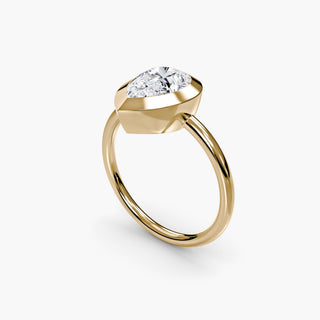 Bezel solitaire engagement ring setting in yellow gold with a pear-shaped lab grown diamond, three-quarter view. || #metal_yellow gold #diamond shape_pear